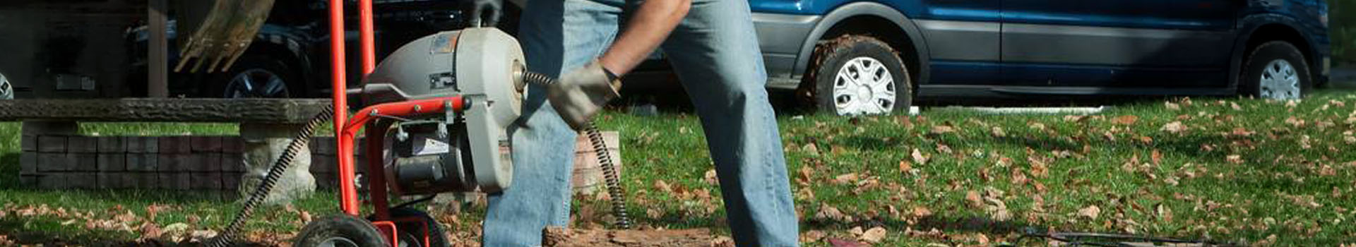 Mario Tedeschi master plumber using and auger to clear a main sewer line